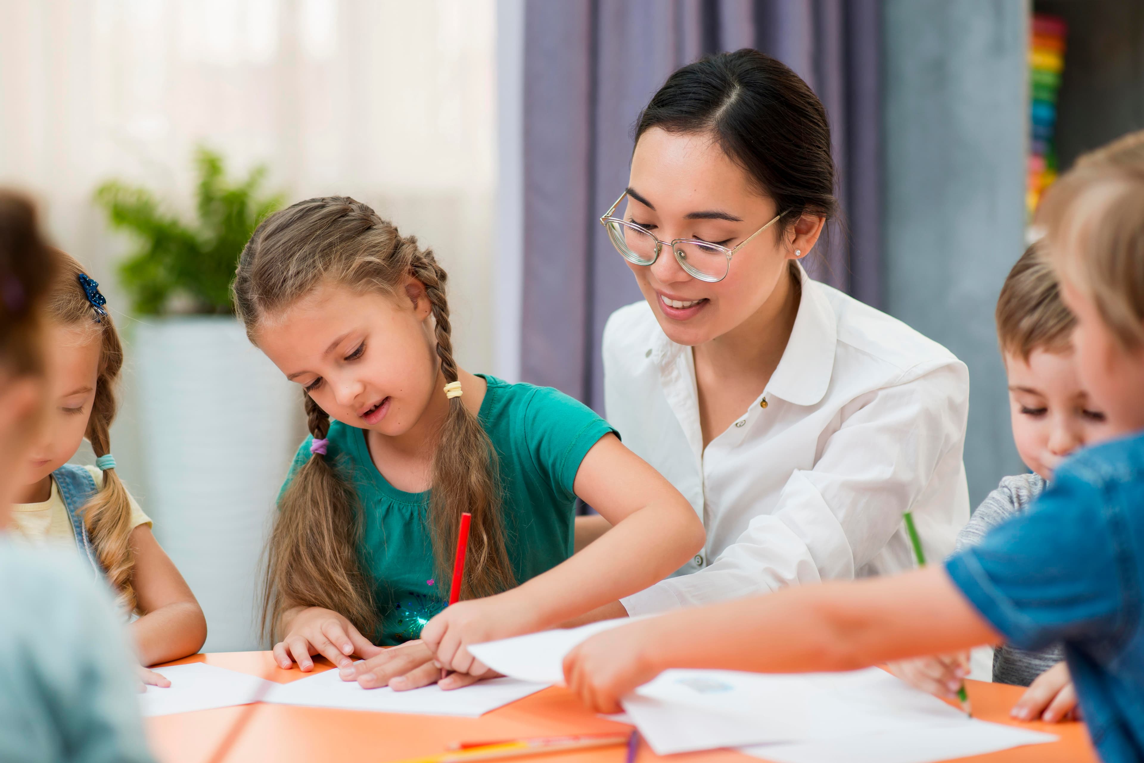 Teacher working with students
